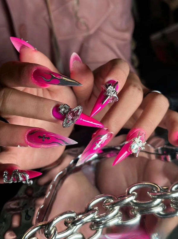 Match Nails hot pink stiletto nails with diamonds