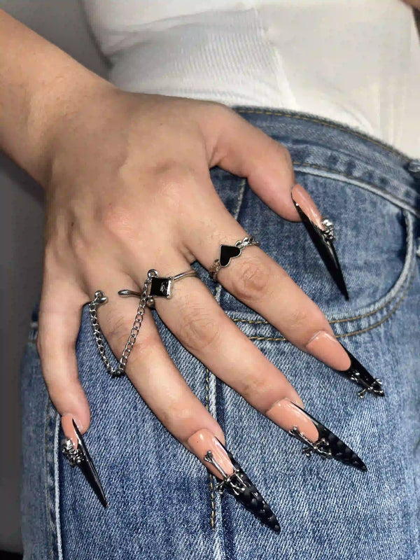 Match Nails black French tip and pink glossy stiletto nails in one hand akimbo