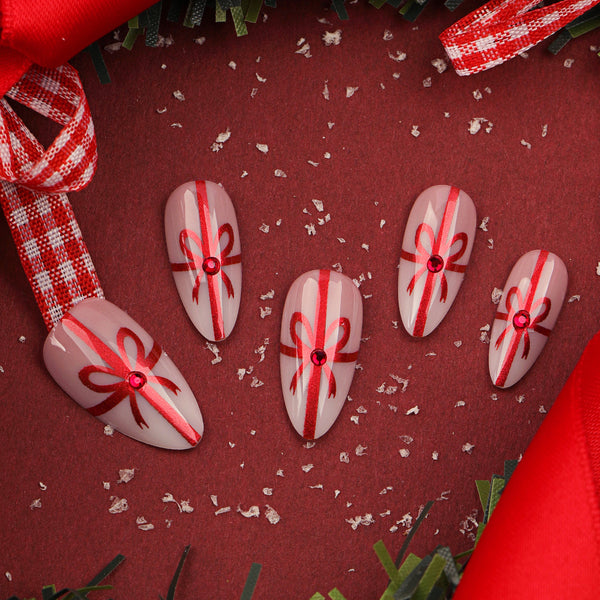 Beautiful glossy cute almond Christmas nails with detailed designs from Match Nails