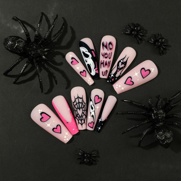 Halloween nail art featuring a spooky spider web coffin in pink