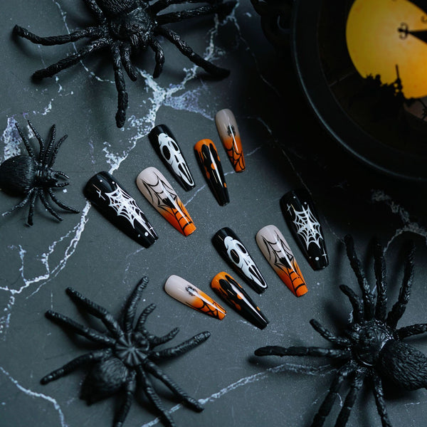 Halloween nail art featuring a spooky spider web coffin design