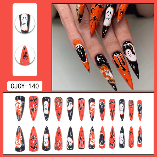 Gothic Halloween nails with a pumpkin spice and ghost theme