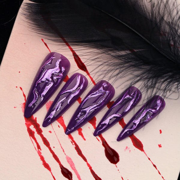 Glamorous spooky purple stiletto Halloween nails from Match Nails