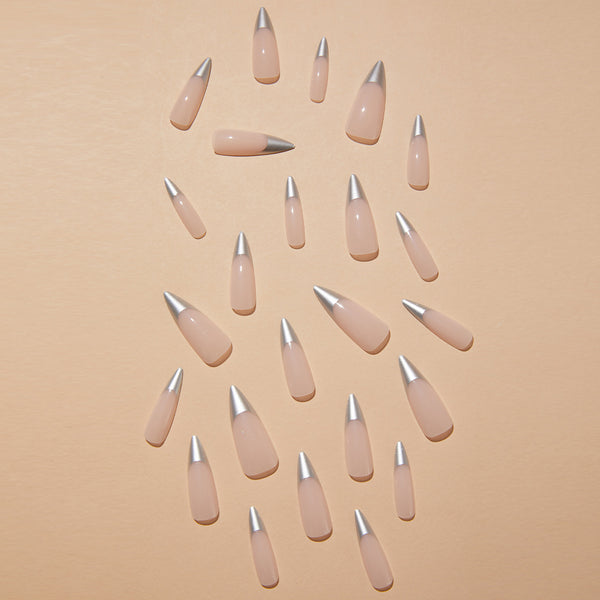 Salon-quality nails at home! Match Nails Effortless French includes long silver stiletto fake nails with all the application tools.