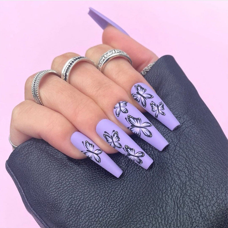 Match Nails: Long coffin press-on nails featuring beautiful butterfly designs for a whimsical and stylish manicure.