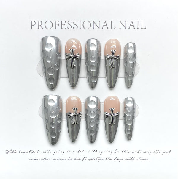 Match Nails Divine Spark: Edgy elegance with long stiletto silver cross false nails.