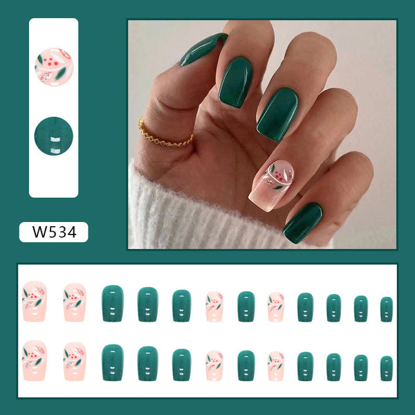 Spring inspired fake nails! Match Nails offers pre-designed glossy square nails in green with beautiful floral accents.