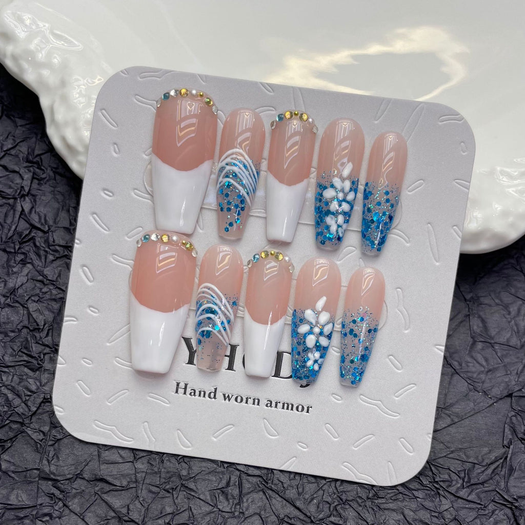 Elevate your style with these meticulously crafted nude and white French tip press-on nails.