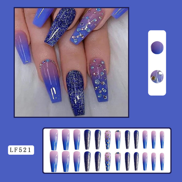 Mesmerizing nails in minutes! Match Nails Night Sky Majesty features long coffin glitter purple fake nails with diamond accents.