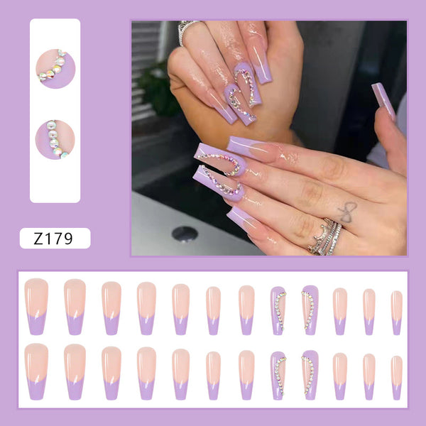 Mesmerizing nails in minutes! Match Nails Enchanting Night features long coffin purple glitter nails with sparkling diamonds.