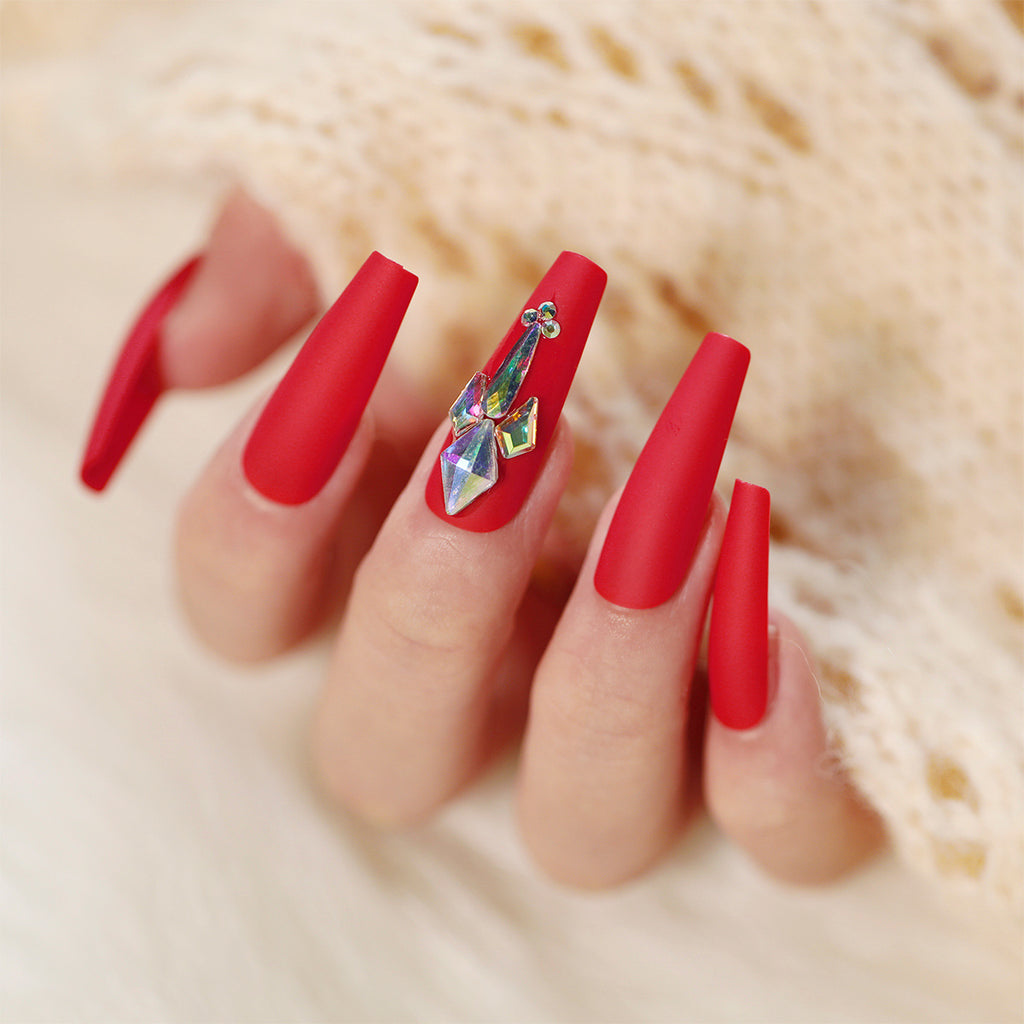 Match Nails: Long red coffin fake nails featuring dazzling diamond accents for a luxurious and glamorous manicure.
